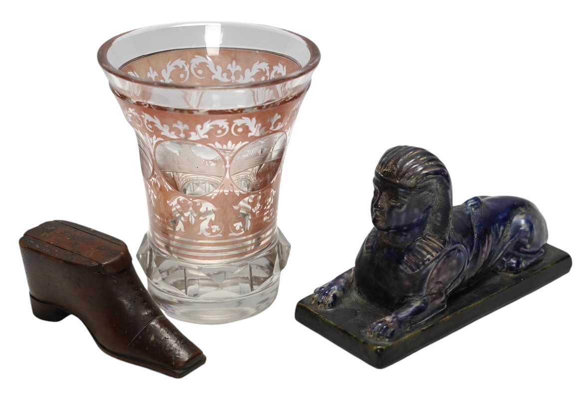 Sundry items comprising a Victorian flashed cut and engraved beaker, a 19th century model of a sphinx, and a green shoe snuff box. Condition - fair